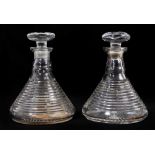 A near pair of 19th century cut glass ship's decanters, with banded decoration to the bodies, 23cm h