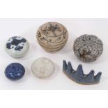 Five Chinese porcelain boxes and a brush rest