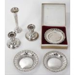 Pair of silver pin dishes, another pin dish in box, a spill vase and pair of silver candlesticks