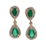 Pair of emerald and diamond pendant earrings, each with two pear cut emeralds surrounded by borders