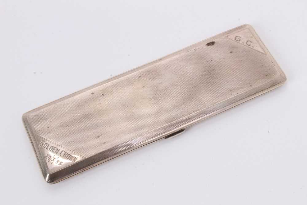 1930s silver cigarette case of narrow rectangular form, with engine turned decoration and engraved G