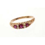 Victorian ruby and diamond ring with three round mixed cut rubies and four old cut diamonds in carve