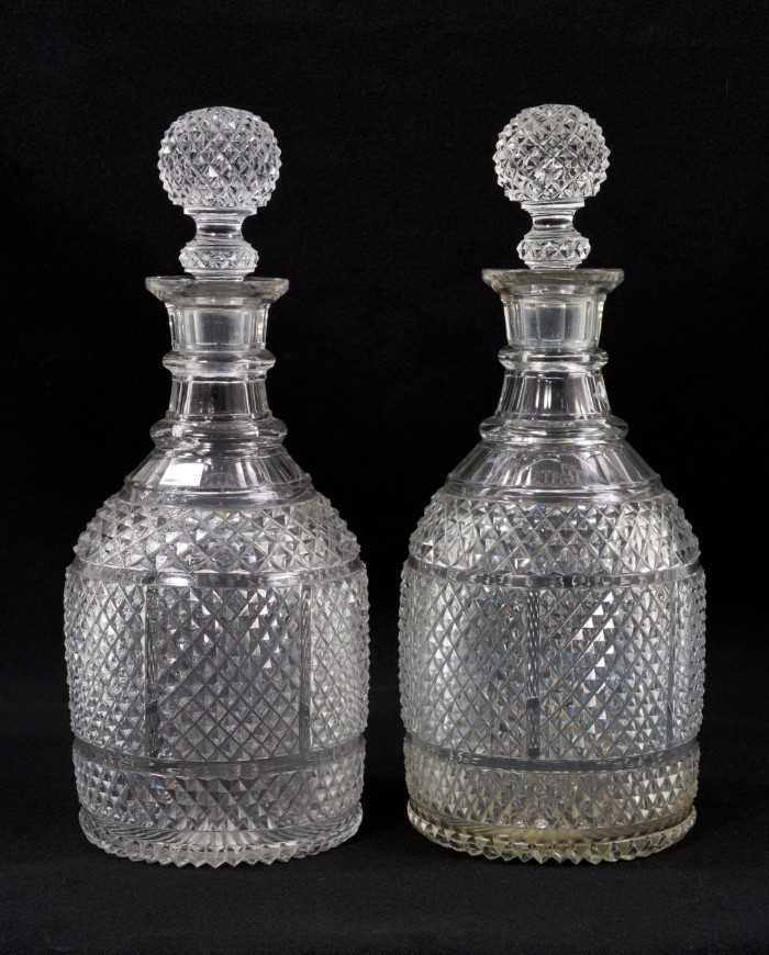 A pair of 19th century ovoid-form two-ring diamond-cut glass decanters with globe stoppers, 28cm hig