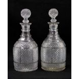 A pair of 19th century ovoid-form two-ring diamond-cut glass decanters with globe stoppers, 28cm hig