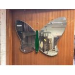 Two frameless wall mirrors, one in the form of a butterfly with green tinted body