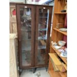 Pair of contemporary narrow wood effect display cabinets with glass shelves to interiors (2)