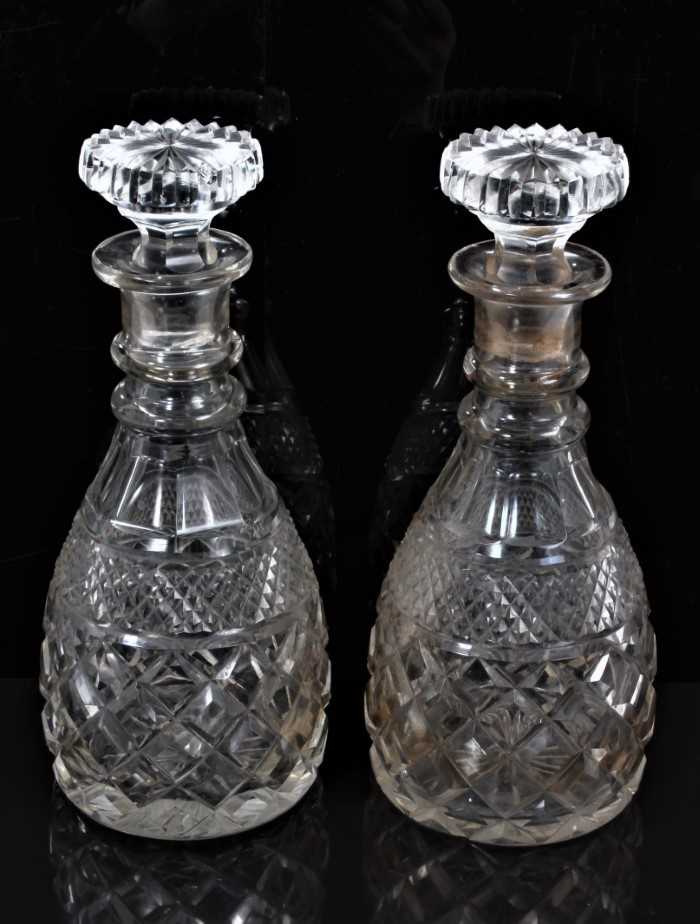 A pair of 19th century two-ring cut glass decanters with mushroom stoppers, 28cm high