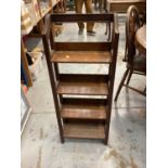 Narrow oak open bookcase, 37cm wide, 15.5cm deep, 94cm high, together with an oak three tier folding