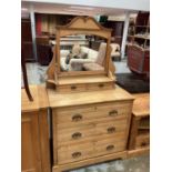 Edwardian golden oak dressing chest of three long drawers with raised mirror back containing a furth
