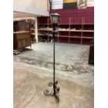Wrought iron standard lamp in the form of a Victorian street light