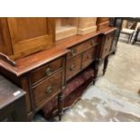 Late Regency mahogany inverted breakfront sideboard with an arrangement of drawers and cupboards on