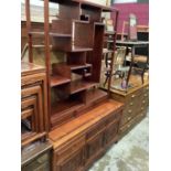 Chinese hardwood display stand on a stand with three drawers and cupboards below