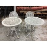 Two wrought iron circular garden tables together with two chairs (4)