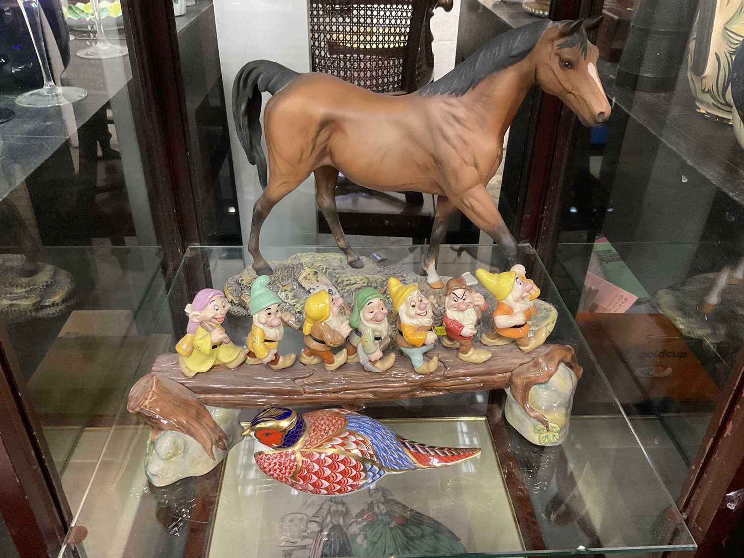 Doulton Figural group of Disney's seven dwarfs, together with Doulton figure of a horse and a Royal