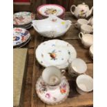 A Meissen bowl with scalloped rim, moulded basket form, with four root and branch legs, together wit