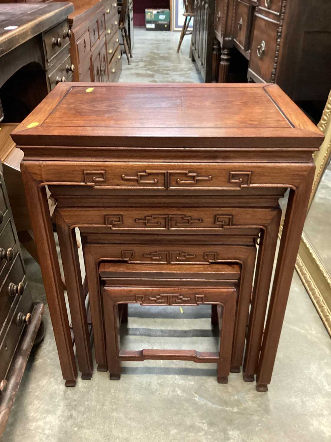 Nest of four Chinese hardwood occasional tables