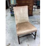 Antique upholstered chair on square legs joined by stretchers