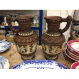 A large pair of continental terracotta jugs