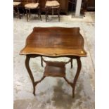 Edwardian two tier occasional table with shaped top on slender cabriole legs