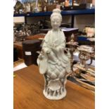 Antique Chinese blanc de chine figure of Guanyin, shown seated on a lotus base, 22cm high