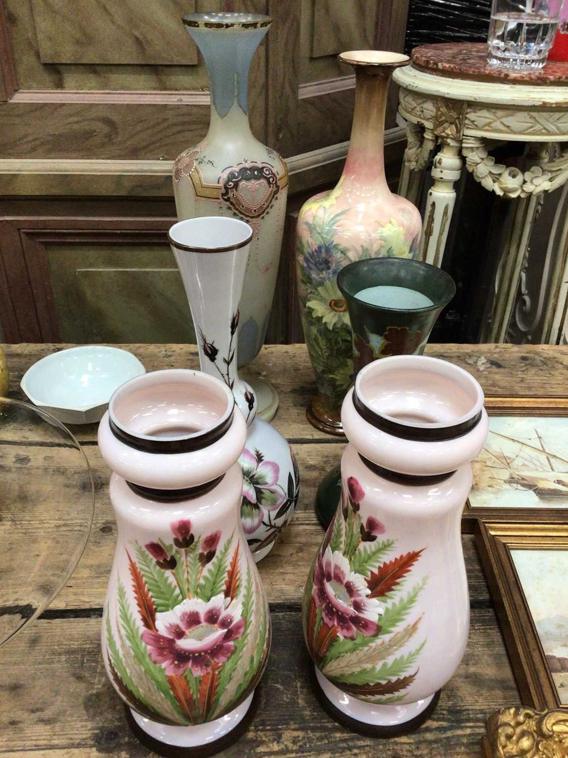 A Doulton Lambeth vase painted with flowers, a Dutch Art Nouveau pottery vase, and four enamelled gl