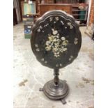 Victorian lacquered tilt top table with mother of pearl inlaid decoration on turned column and circu