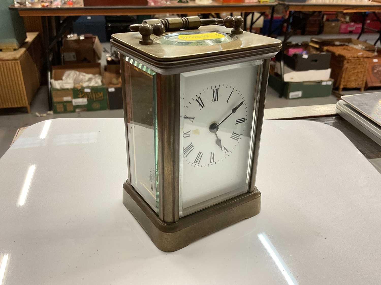 French brass carriage clock with white enamel dial