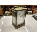 French brass carriage clock with white enamel dial