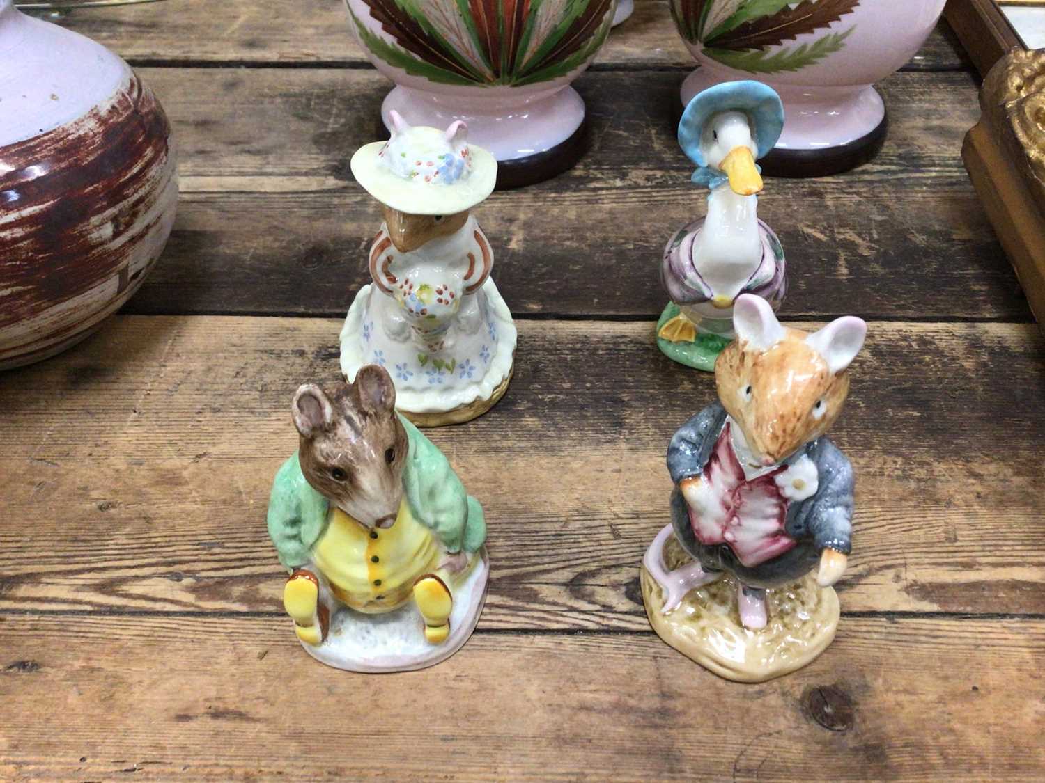 Four Beatrix Potter figures, including two Beswick and two Royal Doulton