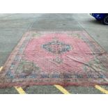 Large Turkey pattern rug with central medallion on red, blue and green ground, 408cm x 343cm