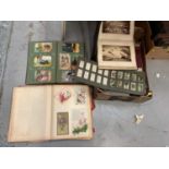 Two boxes of assorted ephemera cigarette cards, tea cards and others