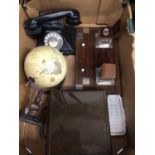 Box of sundries, including a globe, a telephone, a sextant and a desk stand