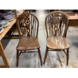 Set of four wheel back chairs together with an elbow chair with cane seat