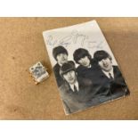 Beatles photo with facsimile signatures, together with miniature album of folding stamps