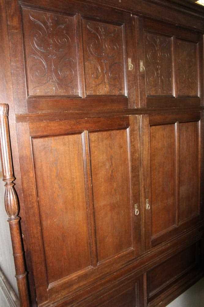 Late 19th / early 20th century Continental carved oak cupboard, enclosed by two pairs of panelled do