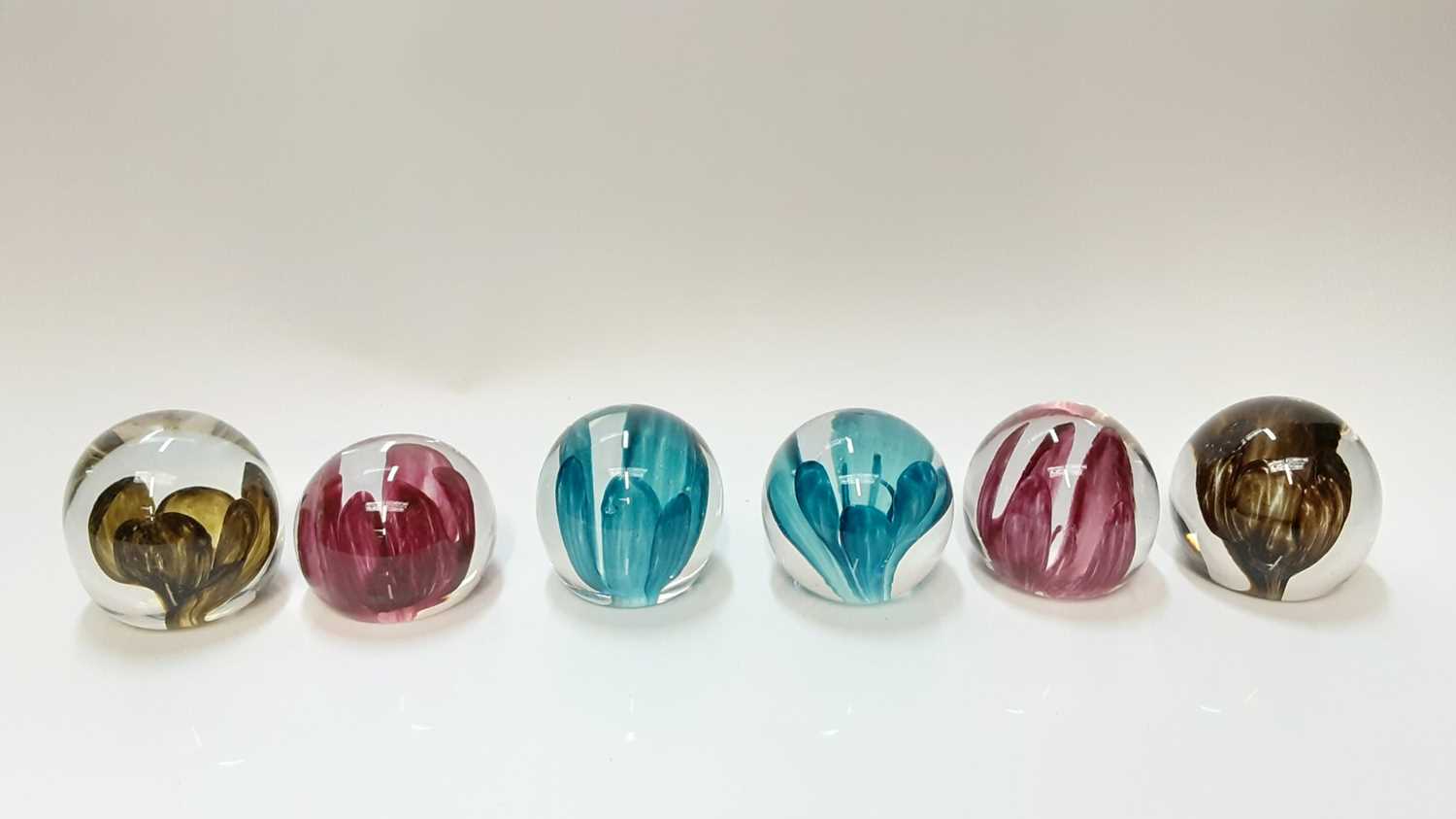 Six Strathearn Orchid (P.4) art glass paperweights, circa. 1970.