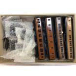 Railway OO gauge selection of Exley tinplate carriages housed in grey cabinet various lines in L.M.S