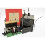 A Merit stationery steam engine, a vertical steam model and related items.