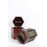 A good quality 30 key rosewood concertina with fretwork ends and bone keys, probably Lachenal, in or