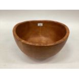 A hand carved beech wood bowl, signed 'Peter Quist - Hetre' to base, 13 1/2" diameter