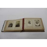 Album containing old photographs, mainly family portrait and ..