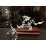 Swarovski crystal Dragon (ball missing), together with juggling Seal, both boxed