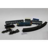 Four boxes of model railway to include locomotive, carrriages, tunnel and accessories (4 boxes)