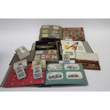Collection of early cigarette cards in wicker hamper