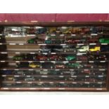 Two glazed front display cabinets with selection of model cars plus various Vanguard empty boxes (qt