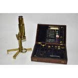 19th century cased brass microscope, in extensively fitted mahogany case.
