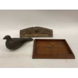 A carved and painted decoy pigeon, a carved oak tray dated 1897, and an Eastern carved nameplate (3)