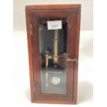 Antique brass microscope in mahogany display case