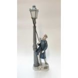 Lladro porcelain figure of a man lighting street lamp, 47.5cm high