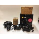 Group of Nikon DSLRs and accessories, including a D70 kit, F90X body, D100 and lend
